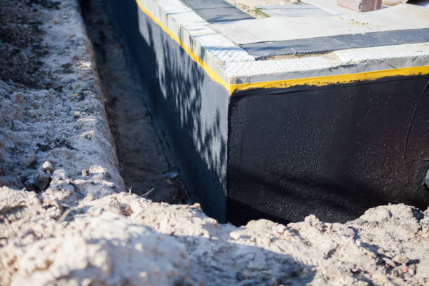 Professional Waterproofing technician working in Woodbine, MD